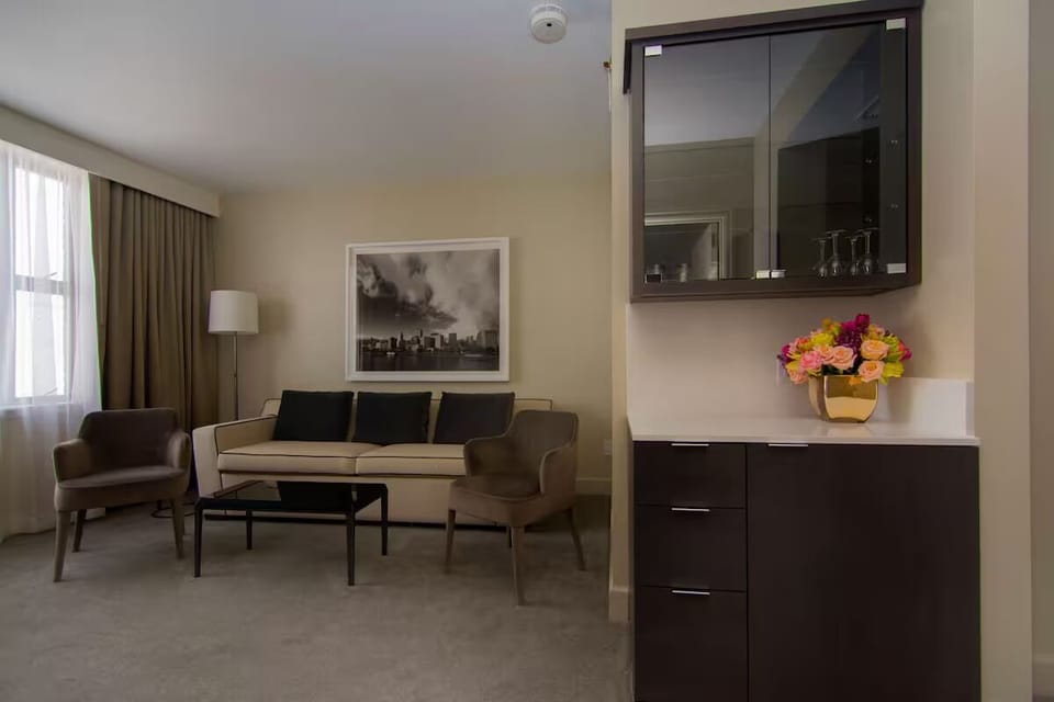 Gather for drinks and conversation in this stylish lounge corner.