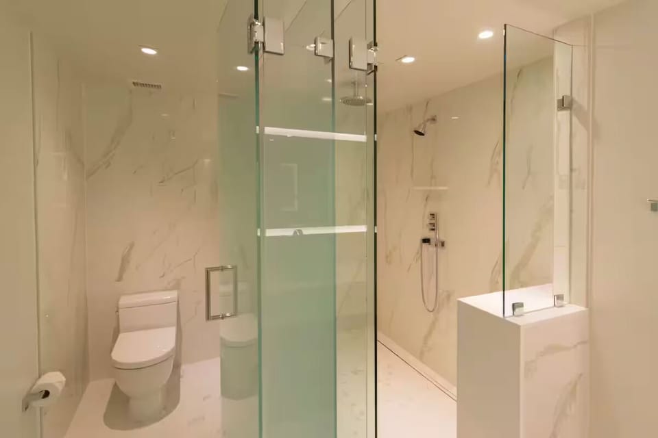 Refresh in a sleek glass shower with spa-like finishes.