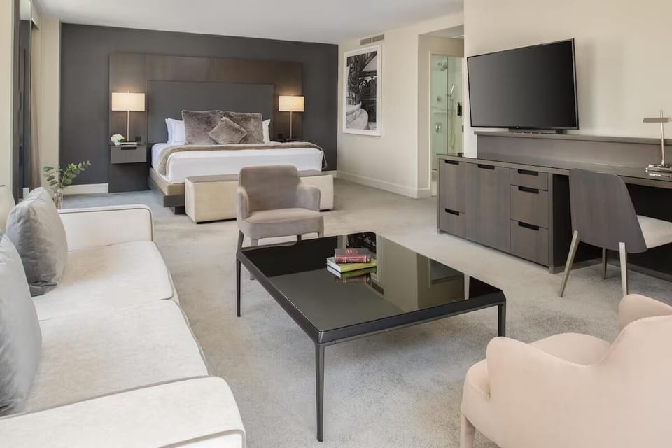 Stretch out in an airy suite with lounge seating and TV.