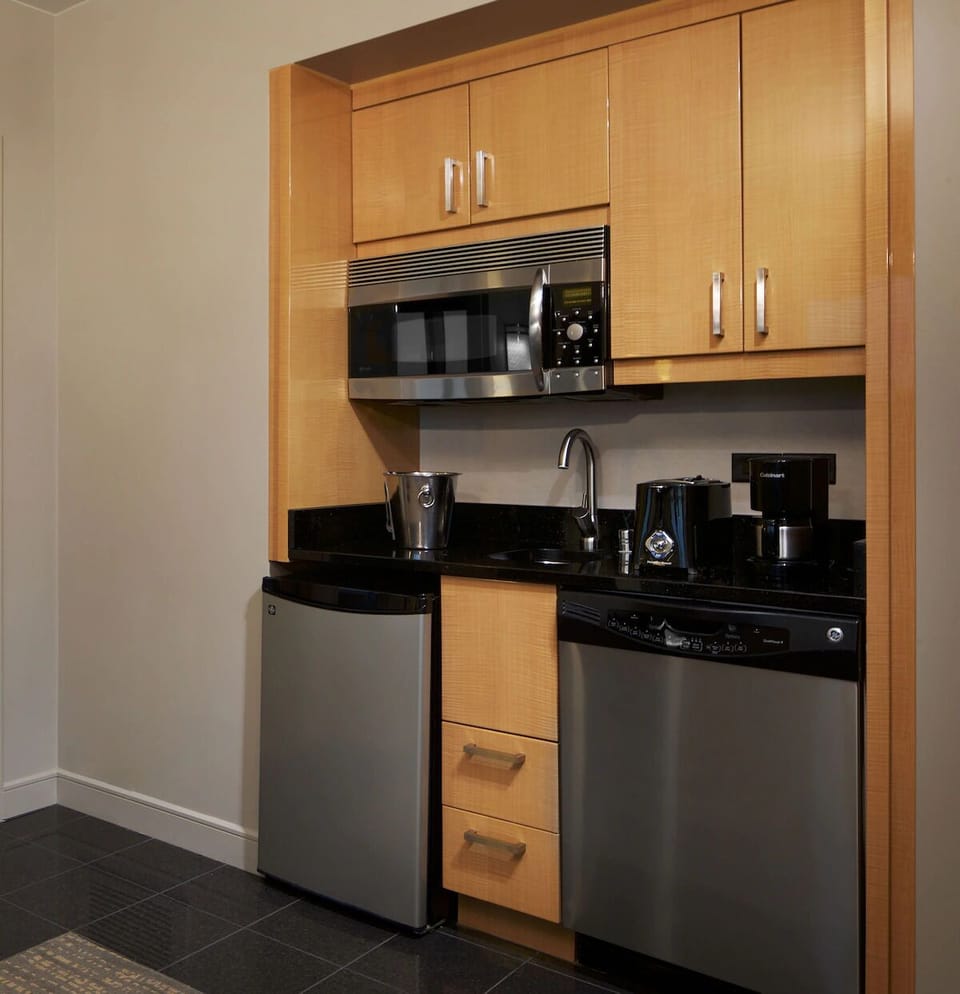 Enjoy easy snacks with a convenient kitchenette and coffee setup.