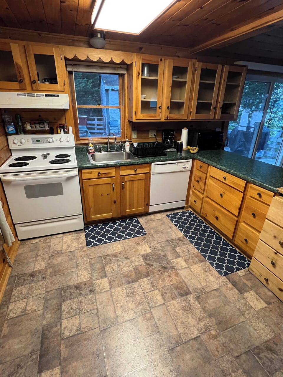 Kitchen with stove, fridge, and dishwasher