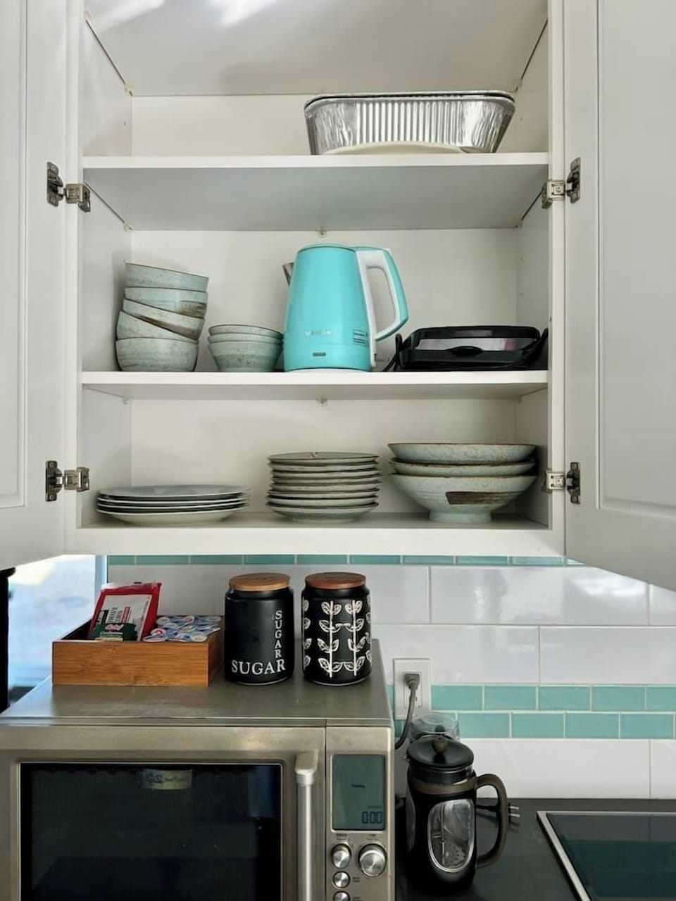 A full set of plates, bowls, silverware and glassware, perfectly arranged for you.