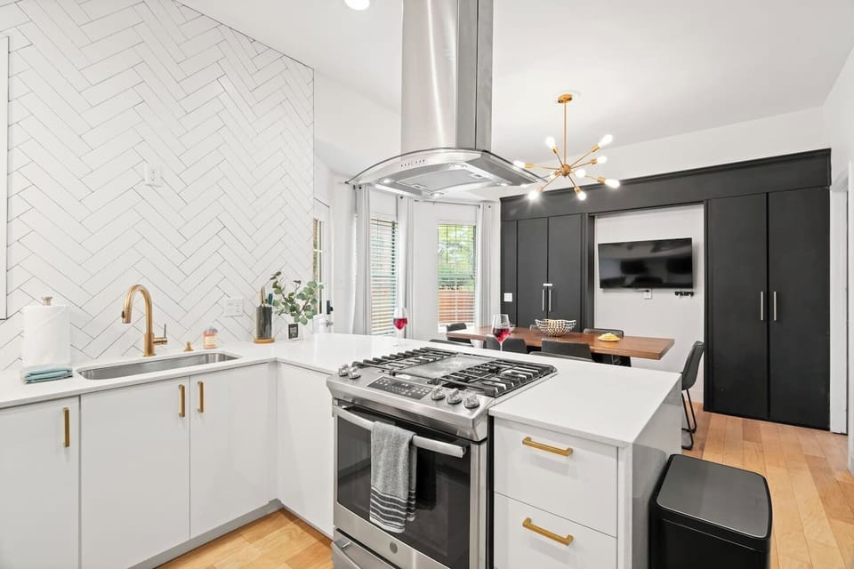 Where gatherings begin and flavors come to life—a kitchen and dining space that feels effortlessly welcoming.
