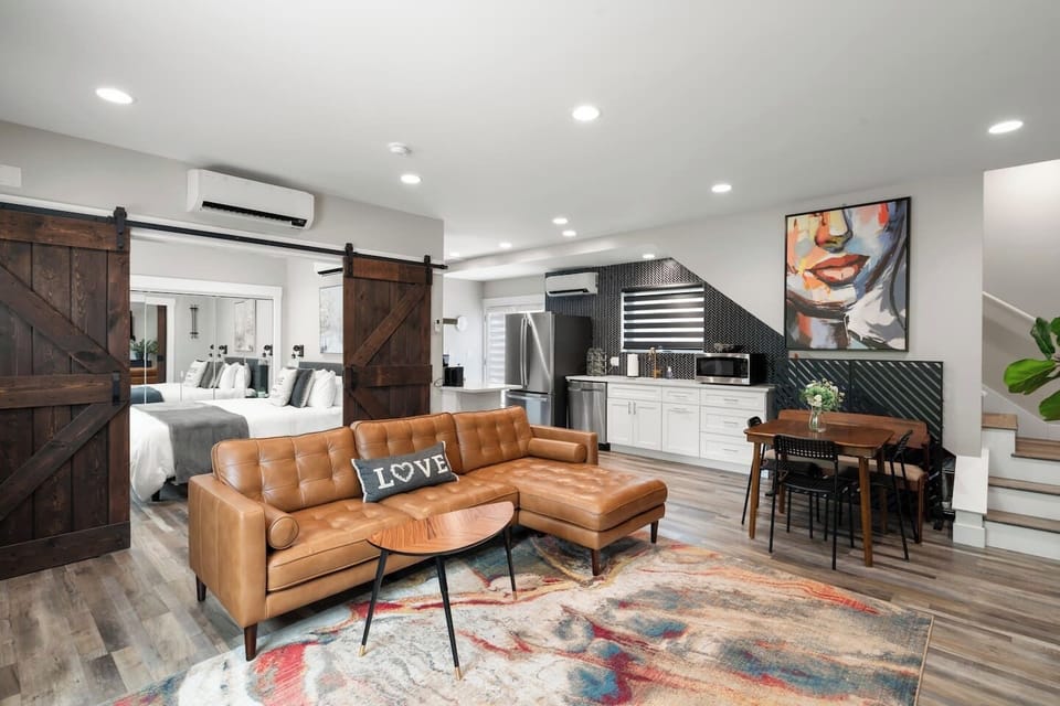 In this second common area, the openness create a sense of spacious calm — paired with luxe leather seating that invites you to sink in and stay awhile.