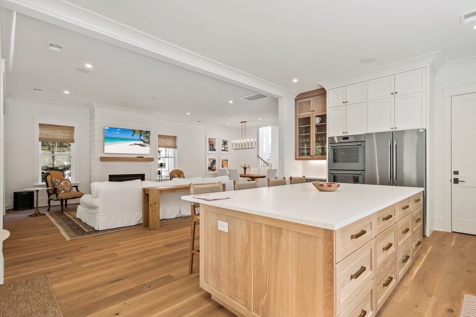 Large kitchen counter with bar stools with seating for 4.