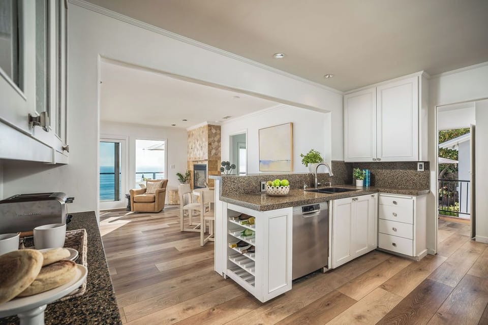 Spacious kitchen features granite countertops and stainless steel appliances