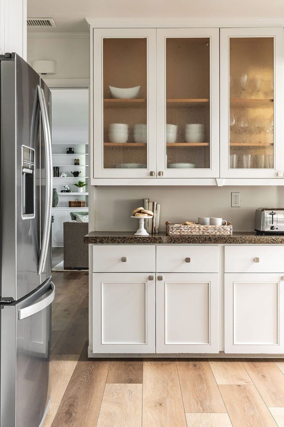 Kitchen is connected by dining area and front parlor