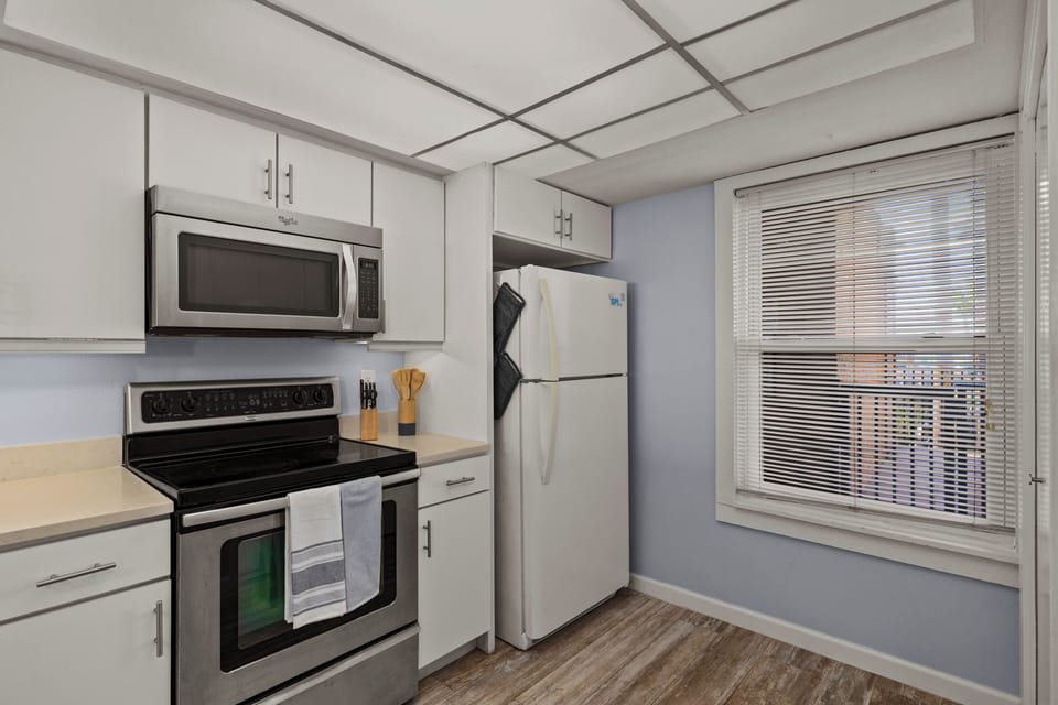 Modern appliances and plenty of counter space make cooking easy.