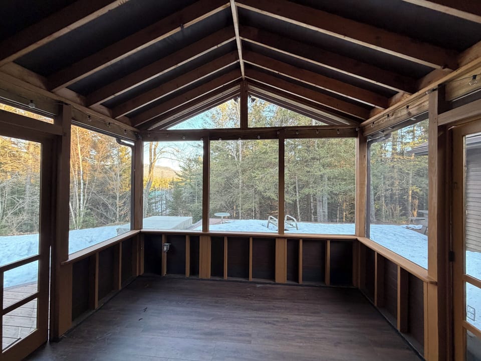 Hot tub, deck, and screened porch. Access through the dining room.