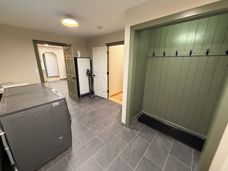 Closet in mudroom for jackets, shoes, and gear.