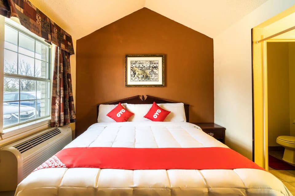 Sink into a plush bed framed by warm, welcoming tones.