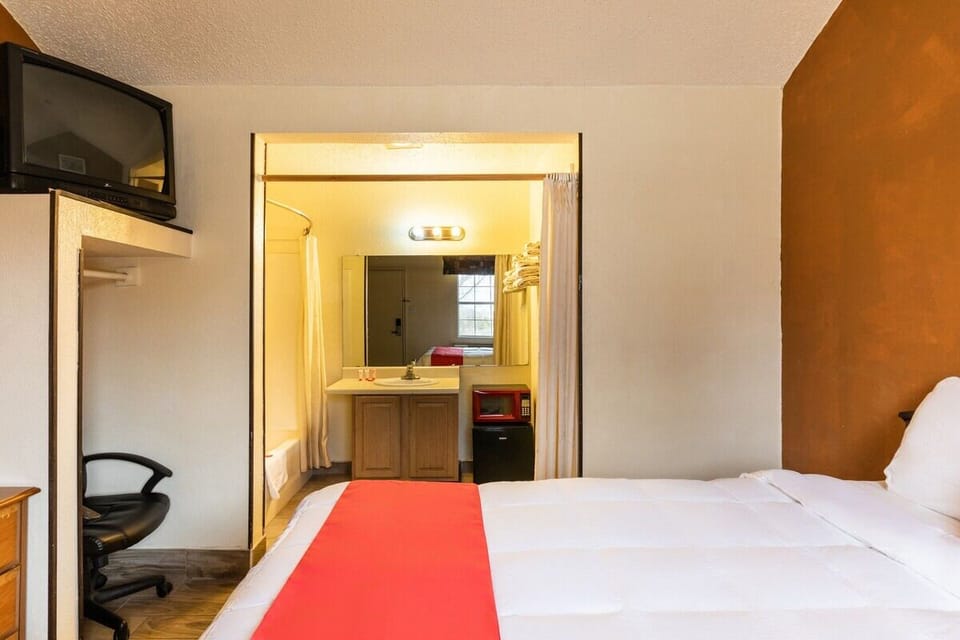 Recharge with convenient in-room workspace and easy vanity access.