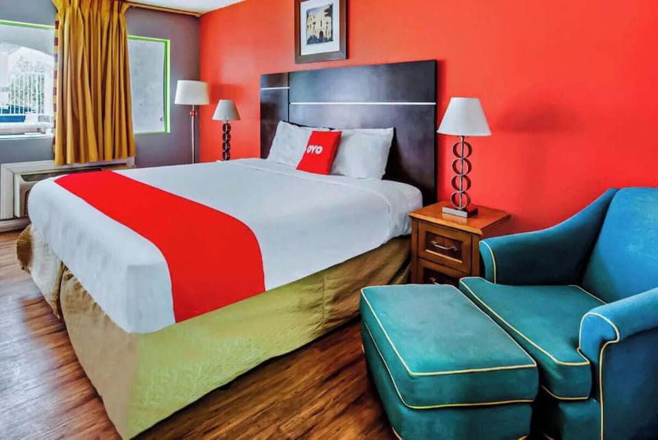 Sink into plush bedding and relax beside cozy seating.