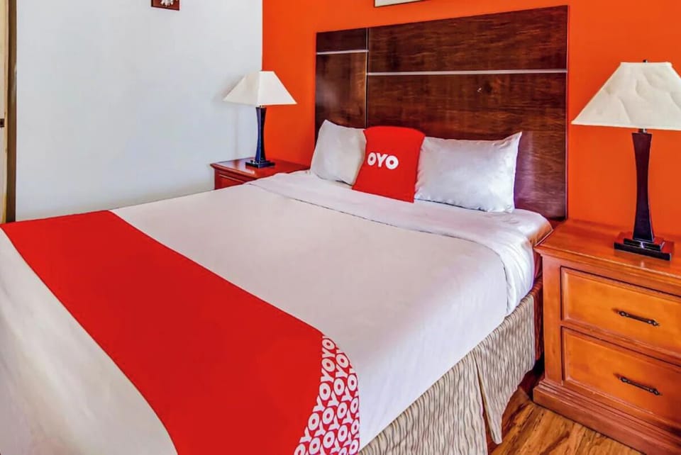 Recharge in crisp linens and warm bedside lighting.