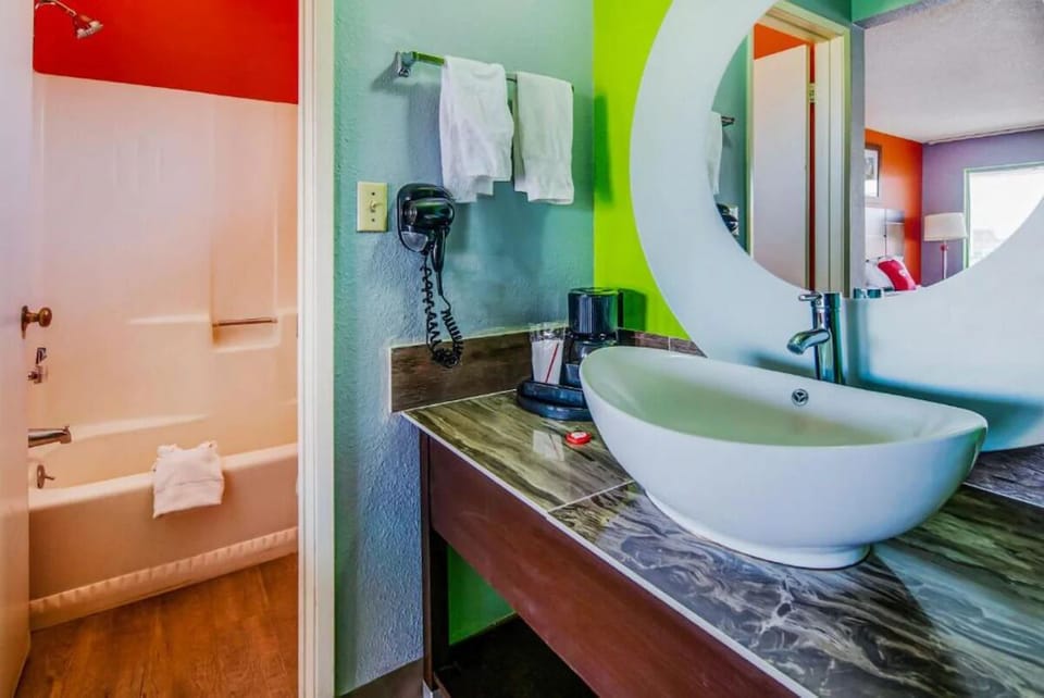Refresh yourself in a bright bath with modern vessel sink.