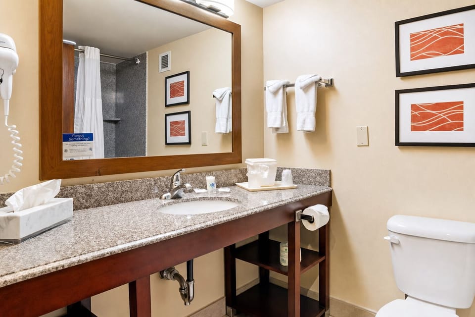 Refresh easily with a wide vanity and bright mirror lighting.