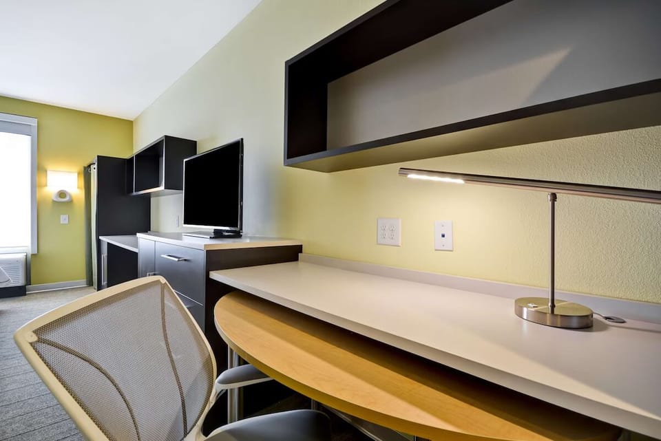 Settle in and focus at a well-lit, comfortable work desk.