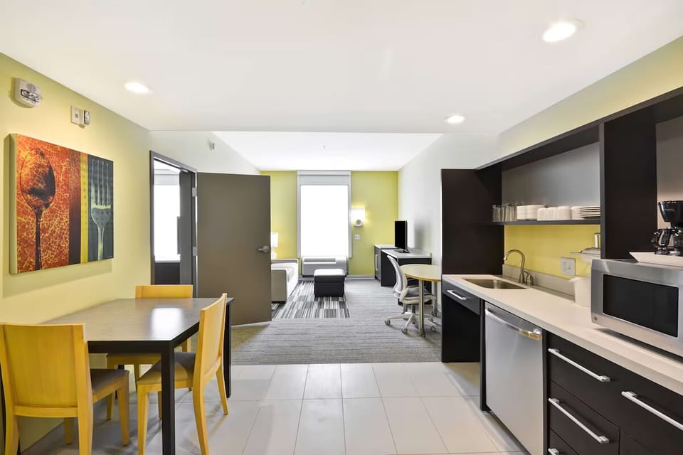 Step into a spacious suite with dining and kitchenette convenience.