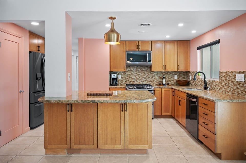 Chef-ready kitchen with granite countertops and stainless-steel appliances.