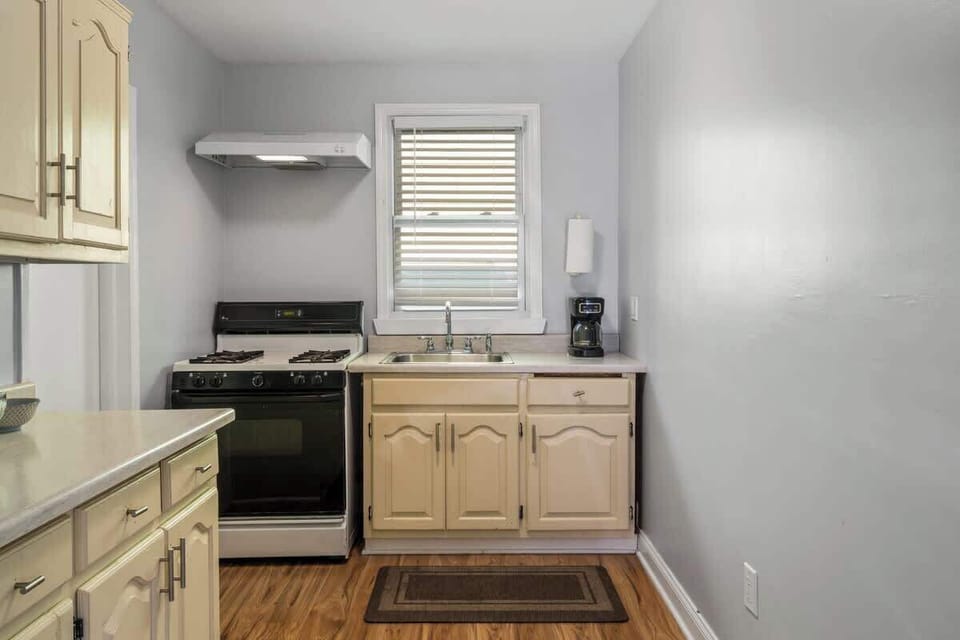 Simple comforts, ready when you are—brew your morning coffee or prepare a hearty dinner in this kitchen.