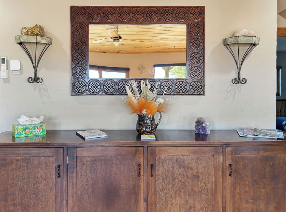 Settle into this warm, thoughtfully decorated space where rustic charm meets comfort. Natural wood textures and artful touches create the perfect atmosphere for your relaxing getaway.