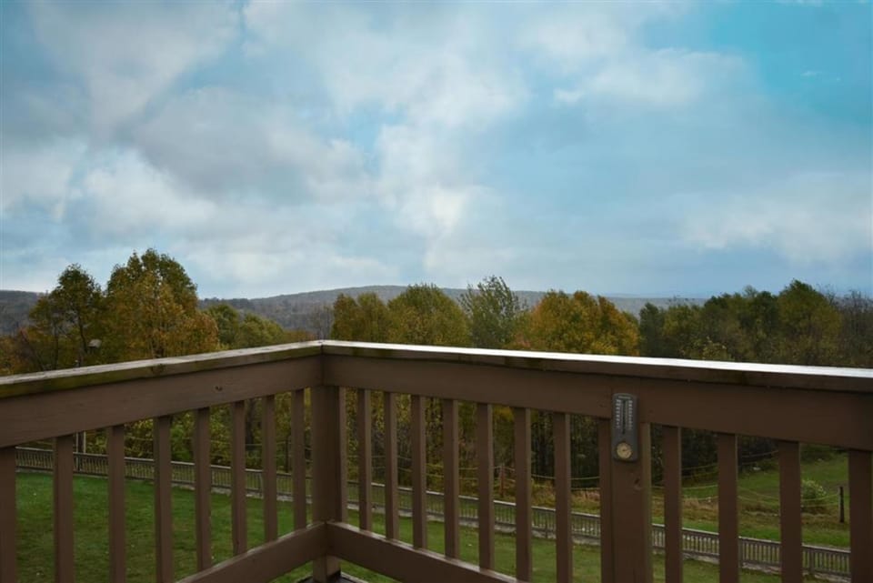 Private deck with serene mountain views, an ideal spot for your morning coffee or evening unwind.