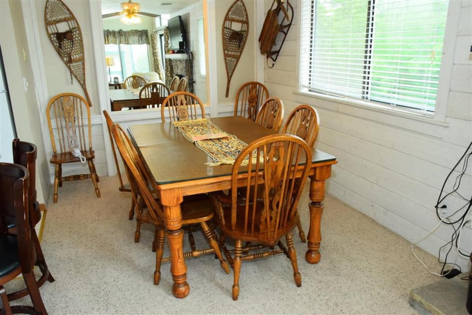 Dining area with seating for six, perfect for family dinners or game nights after a day on the slopes.