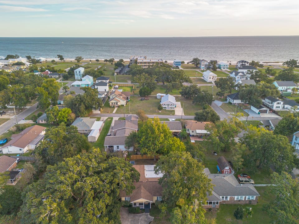 Soak in stunning views of the Gulf from above, where the charm of the neighborhood blends beautifully with the sparkling shoreline just a stone's throw away.