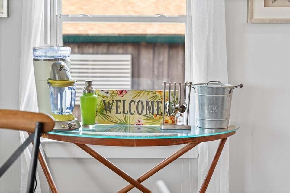 Welcoming entry detail with coastal decor accents and inviting guest experience.