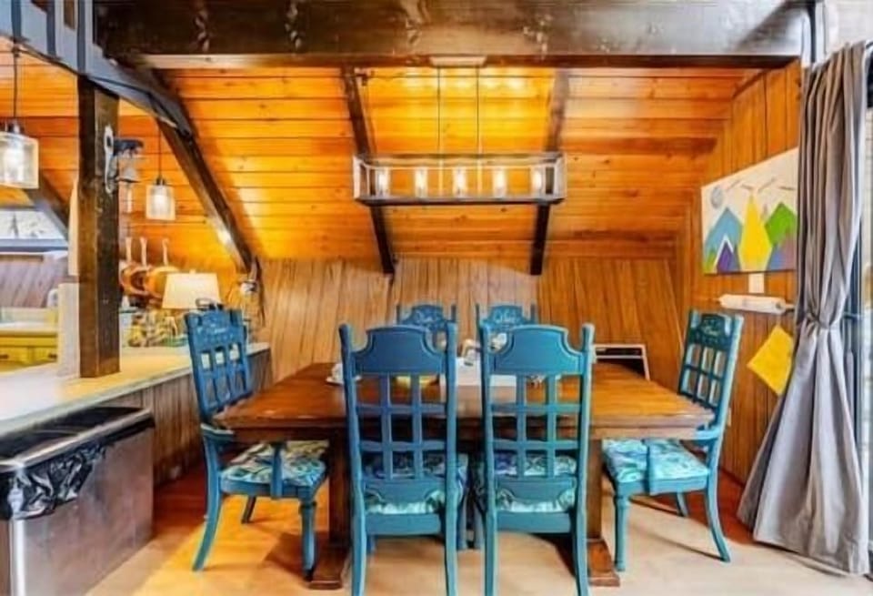 Dining table seats six with a high chair available.