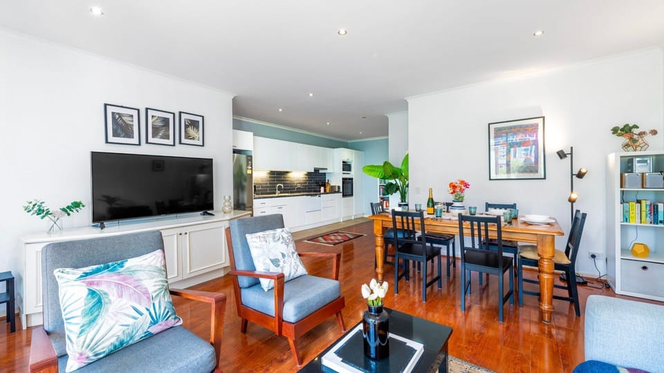 Open-plan living space with modern furniture, perfect for both relaxation and entertaining.