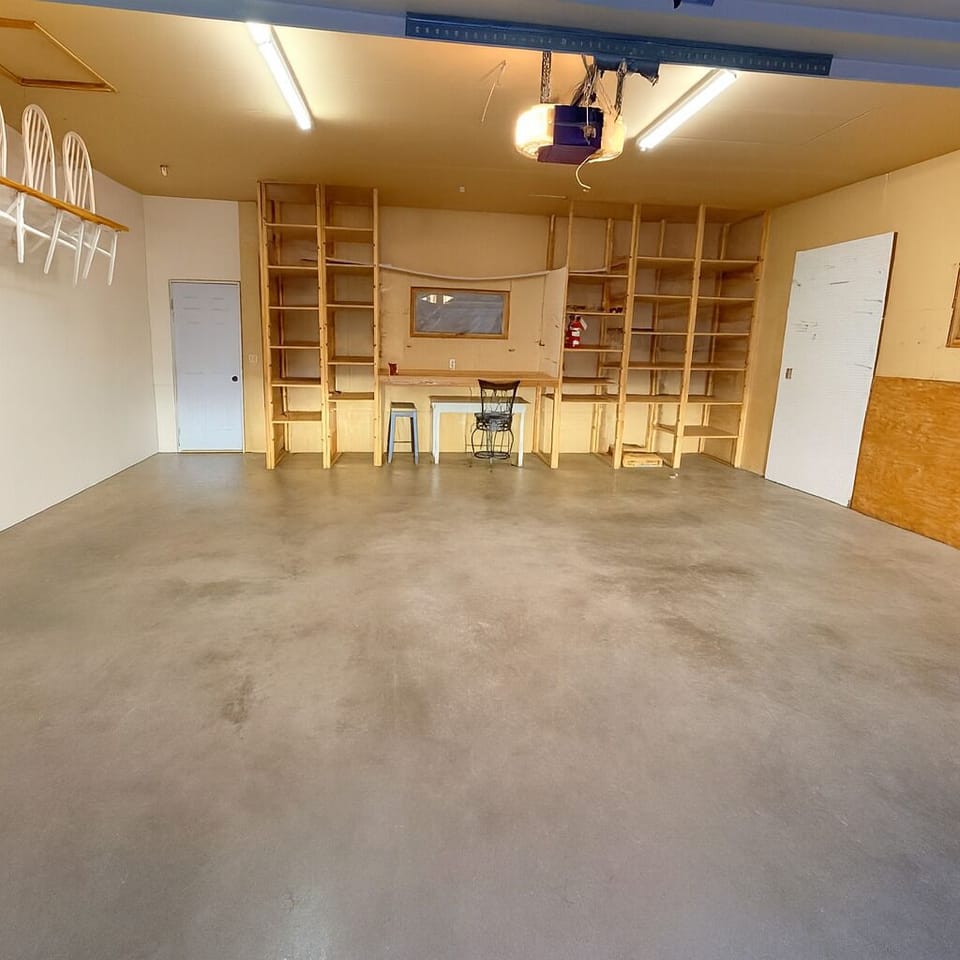 2 car attached garage with EV charger inside and RV hookups outside.