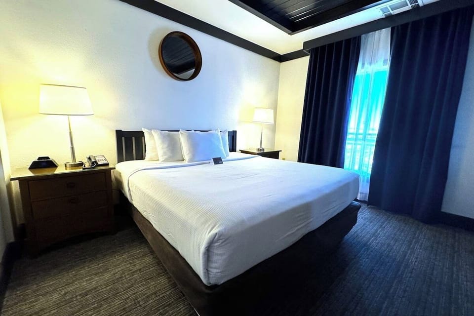 Drift into deep sleep in crisp linens and soft light.