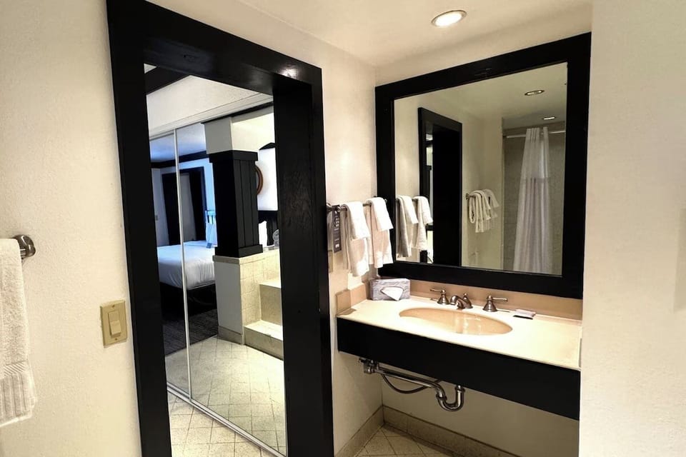 Refresh at the bright vanity before stepping into the shower.