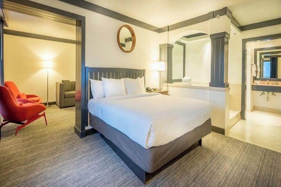 Enjoy a boutique-style suite with open vanity and king bed.