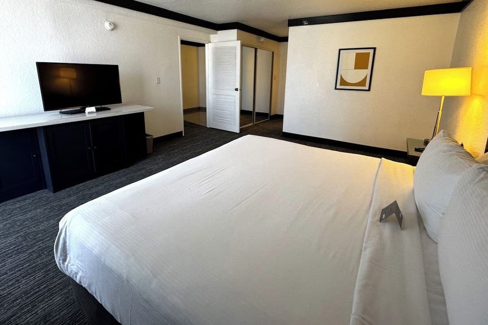 Settle in with crisp linens and a relaxing TV view.