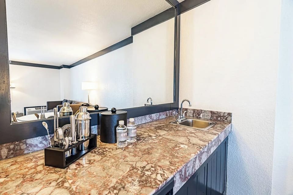 Sip morning coffee at the sleek wet bar station.