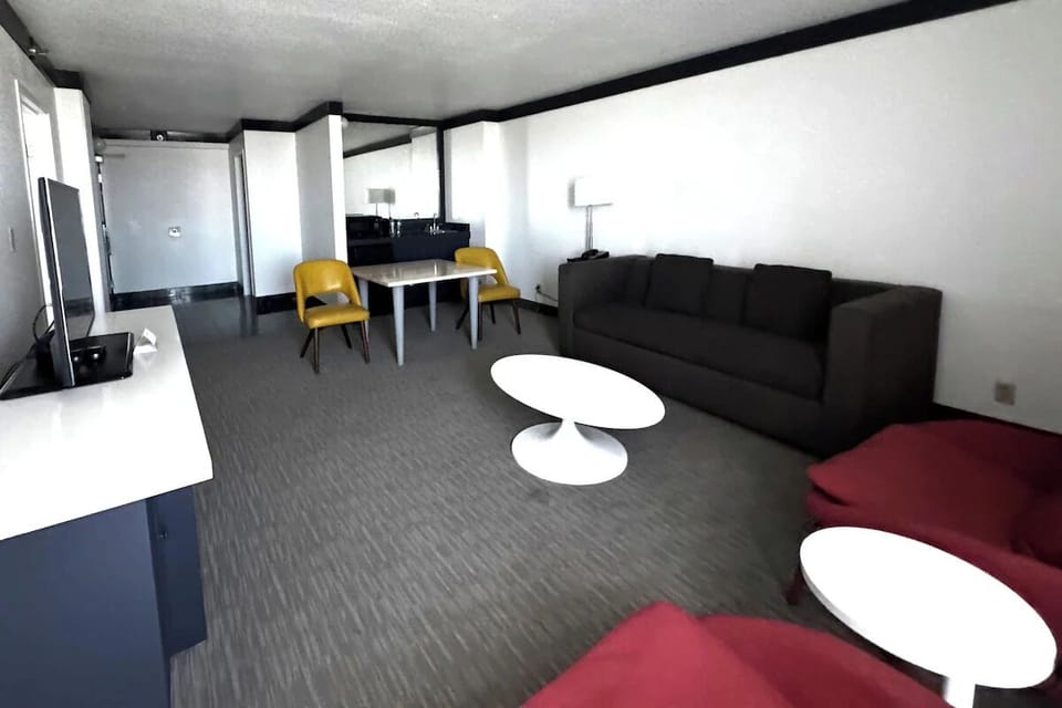 Unwind in the spacious lounge with modern seating and TV.
