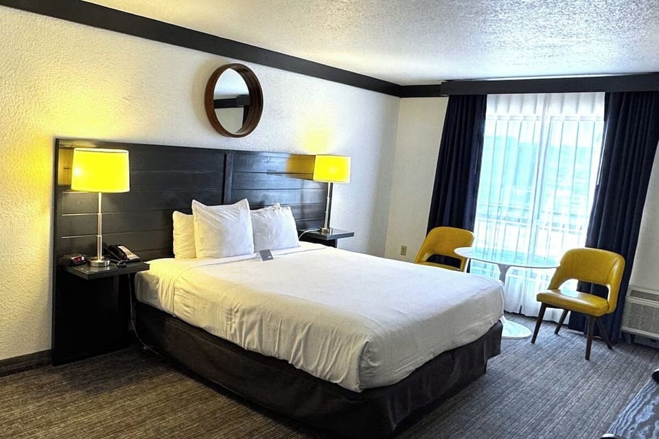 Relax by the window with cozy seating and soft glow.
