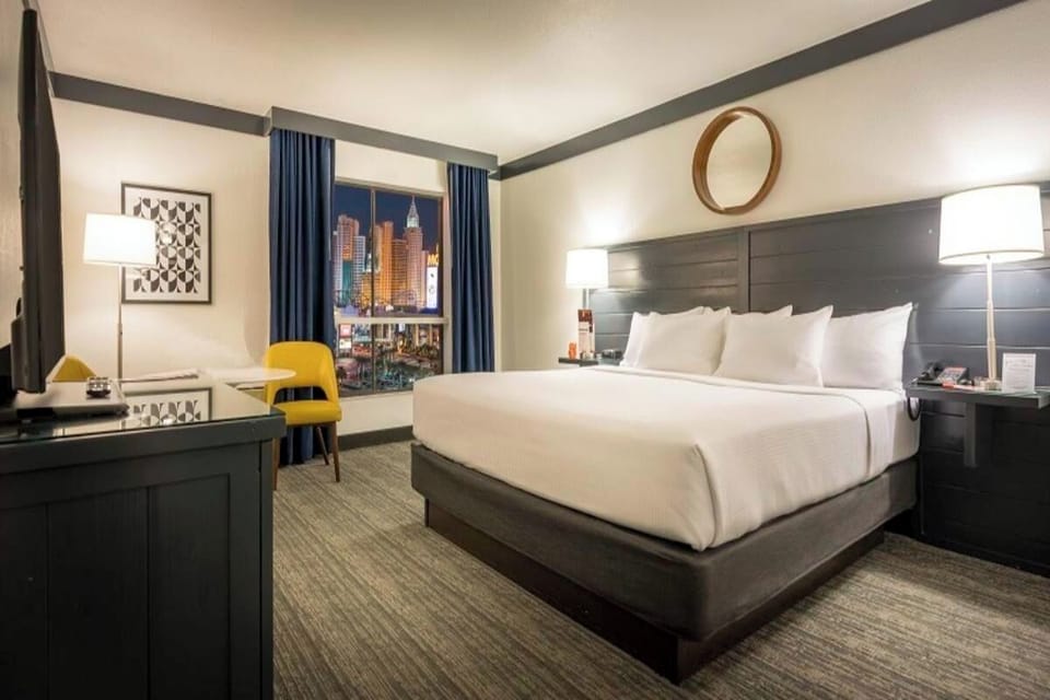 Unwind in a bright king room with stylish city view.