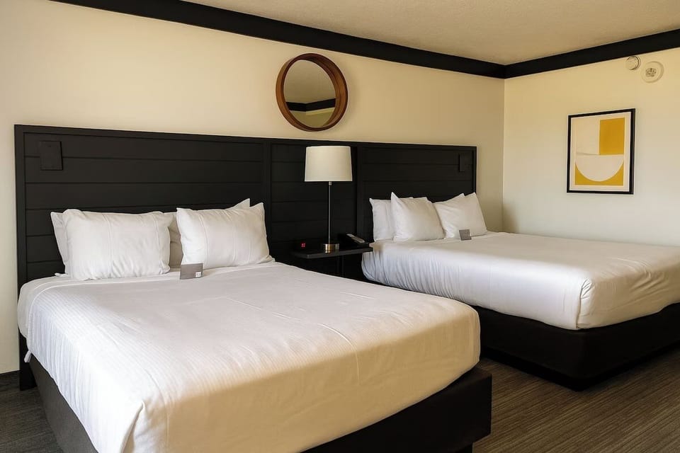 Drift off on crisp linens under warm bedside lighting.