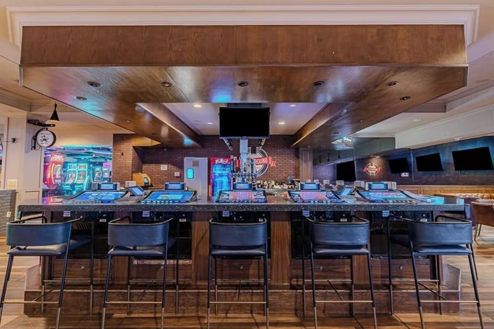 Gather for cocktails at the lively bar, then play.