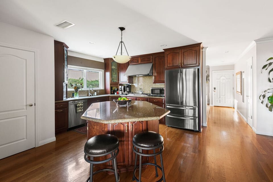 A large, well-appointed kitchen offering plenty of storage, extra seating, and everything you need for a comfortable stay.