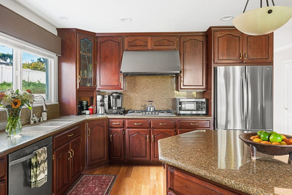 A large, well-appointed kitchen offering plenty of storage, extra seating, and everything you need for a comfortable stay.