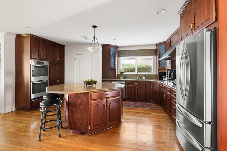 A large, well-appointed kitchen offering plenty of storage, extra seating, and everything you need for a comfortable stay.