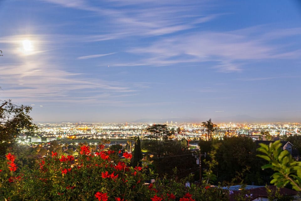 End the day with a peaceful nighttime soak in the hot tub, overlooking sparkling city views