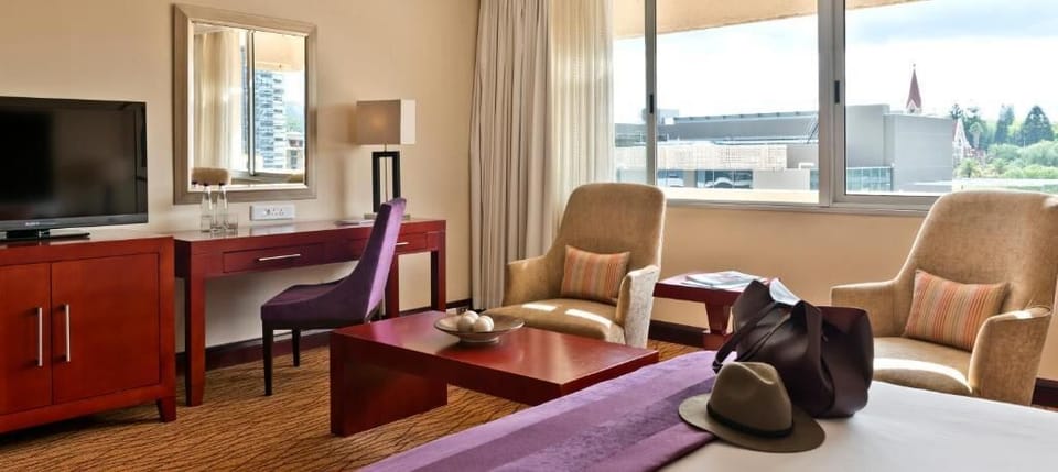 Kick back with TV, workspace, and comfortable lounge seating.