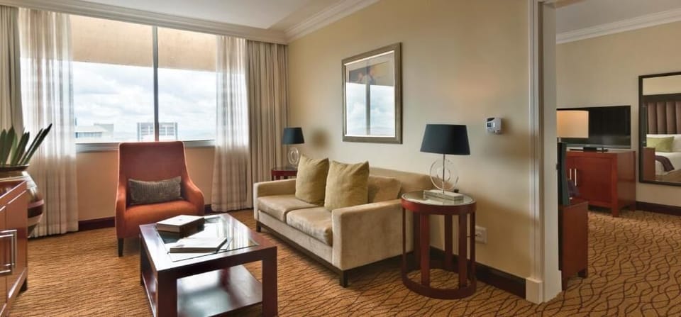Dine together in an airy suite with skyline views.