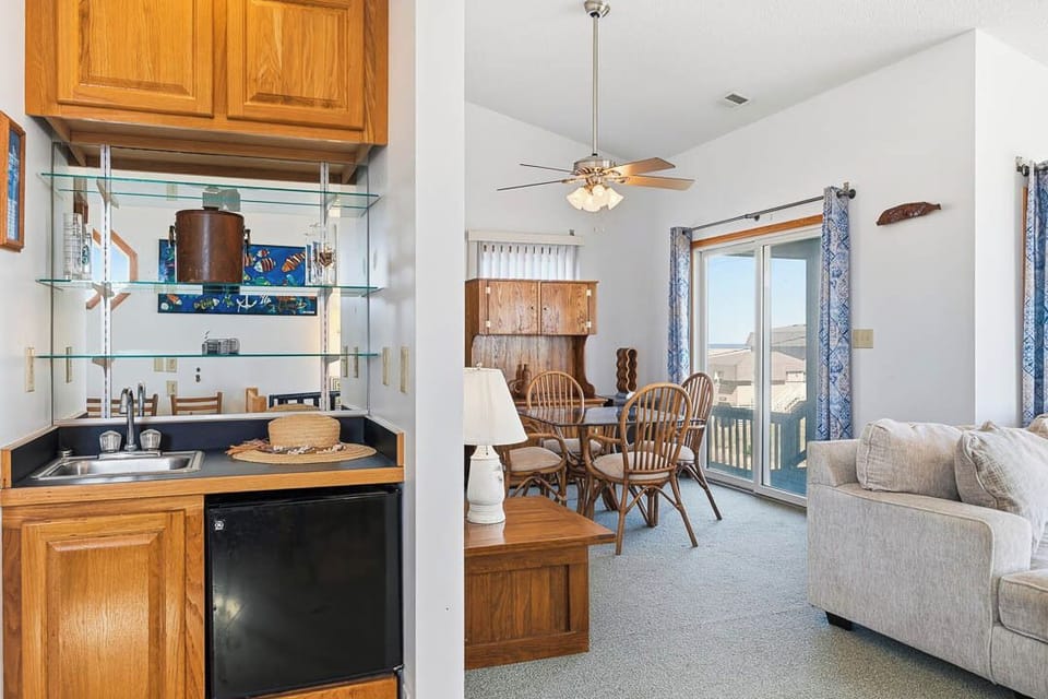 Top-Level Den with Wet Bar and Deck Access
