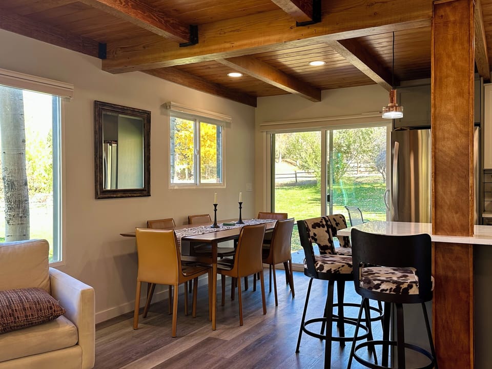 Dining area beside the kitchen, with easy access to the deck and outdoor views